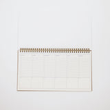 Spiral-bound planner on a white background