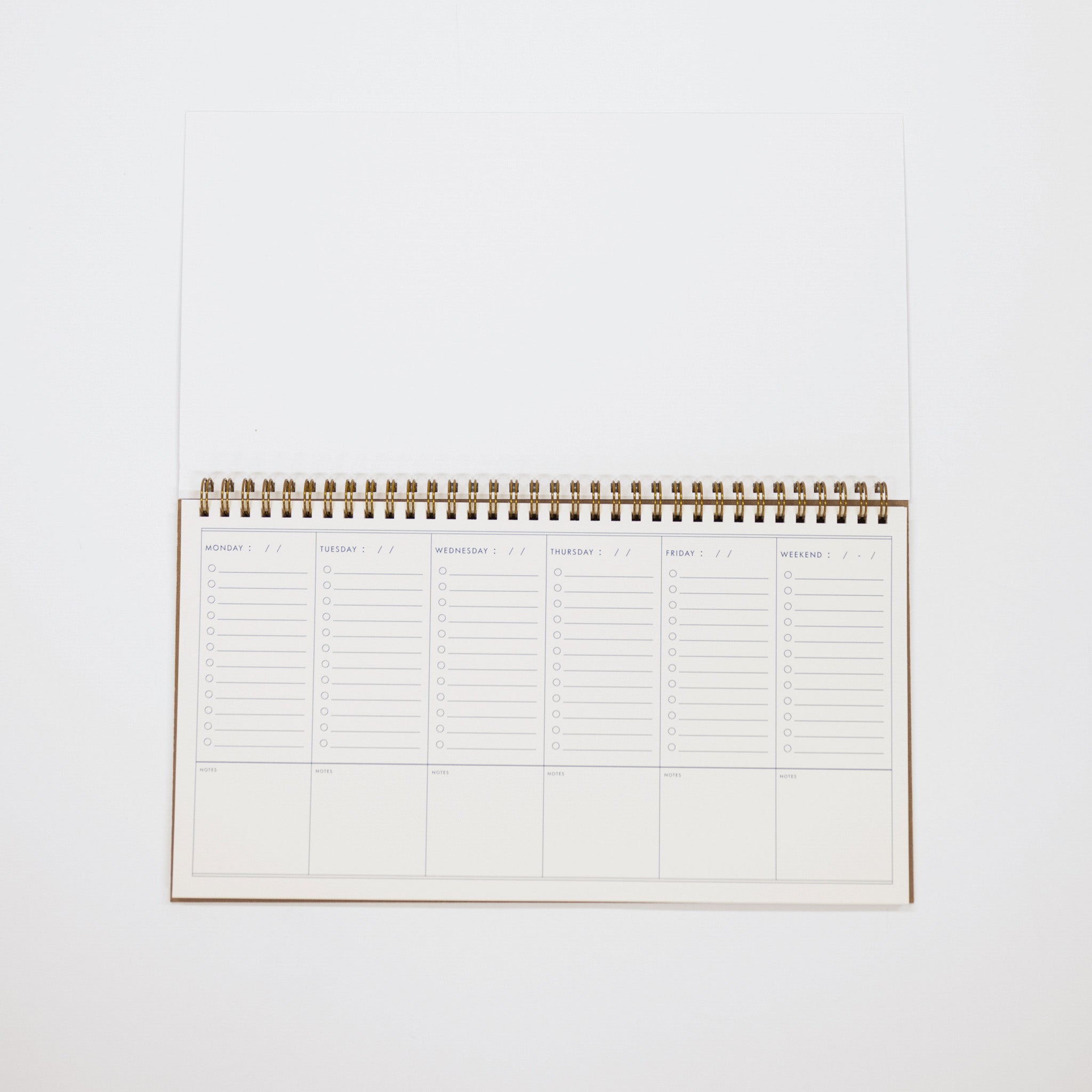 Spiral-bound planner on a white background