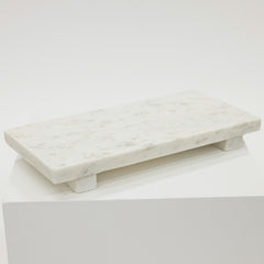 Marble tray on a white surface with a white background