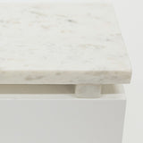 Close-up of a marble riser with a white base on a light gray background