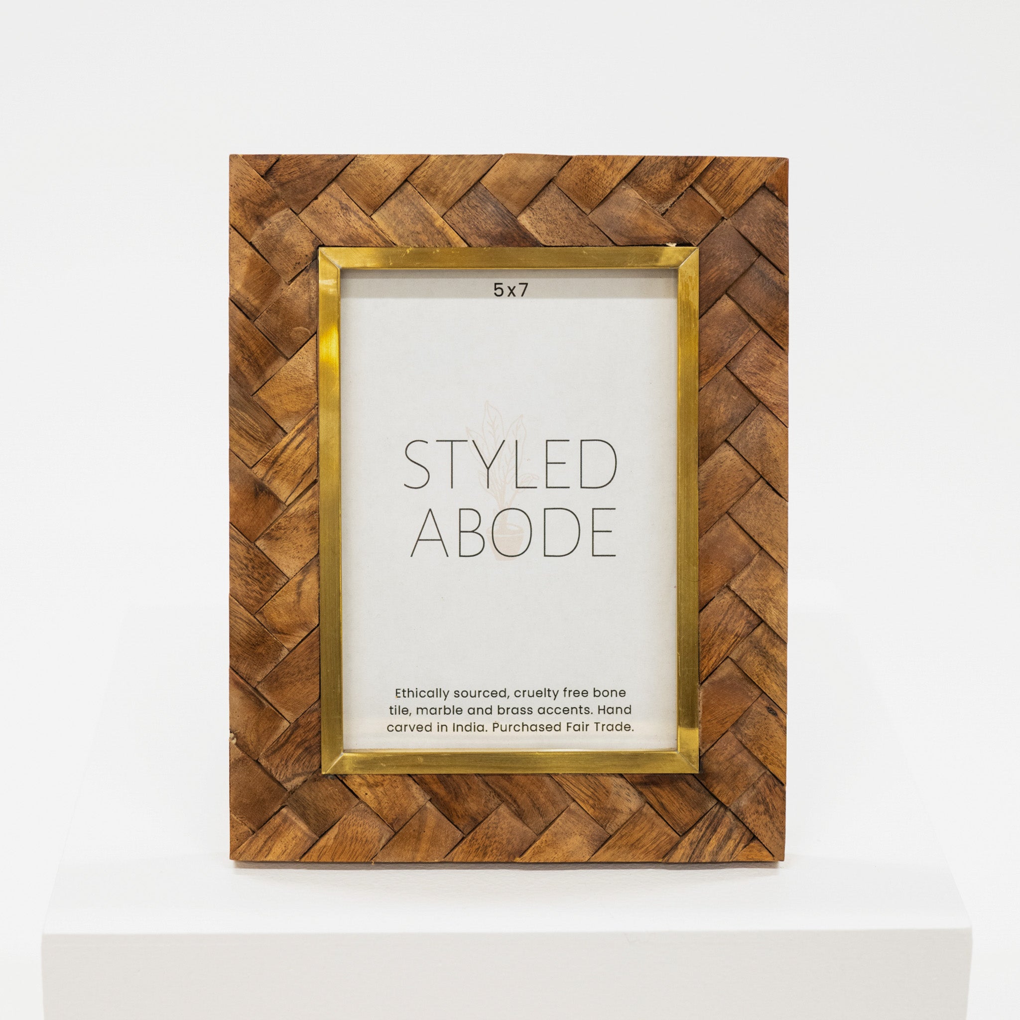 Wooden photo frame with gold accents on a white background