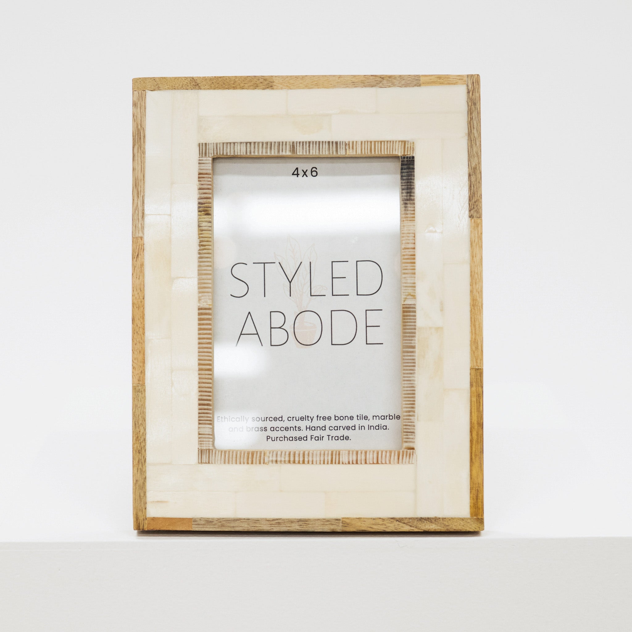 Wood and cream tile picture frame with 'Styled Abode' label on a white background