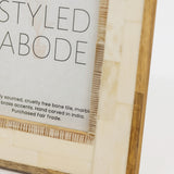 Wood and cream tile frame with 'STYLED ABODE' text on a white background