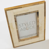 Wood and cream tile picture frame with 'Styled Abode' branding on a white background