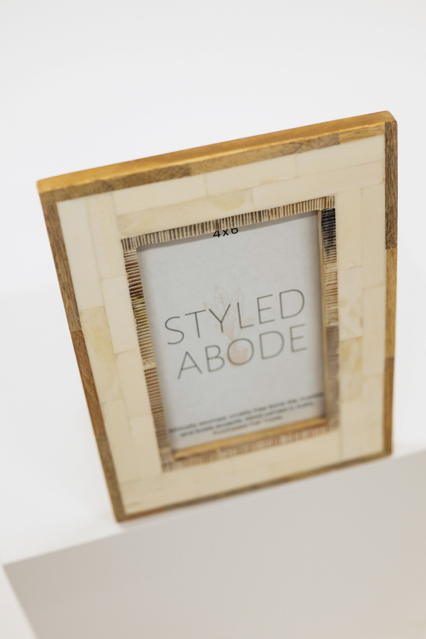 Wood and cream tile picture frame with 'Styled Abode' branding on a white background
