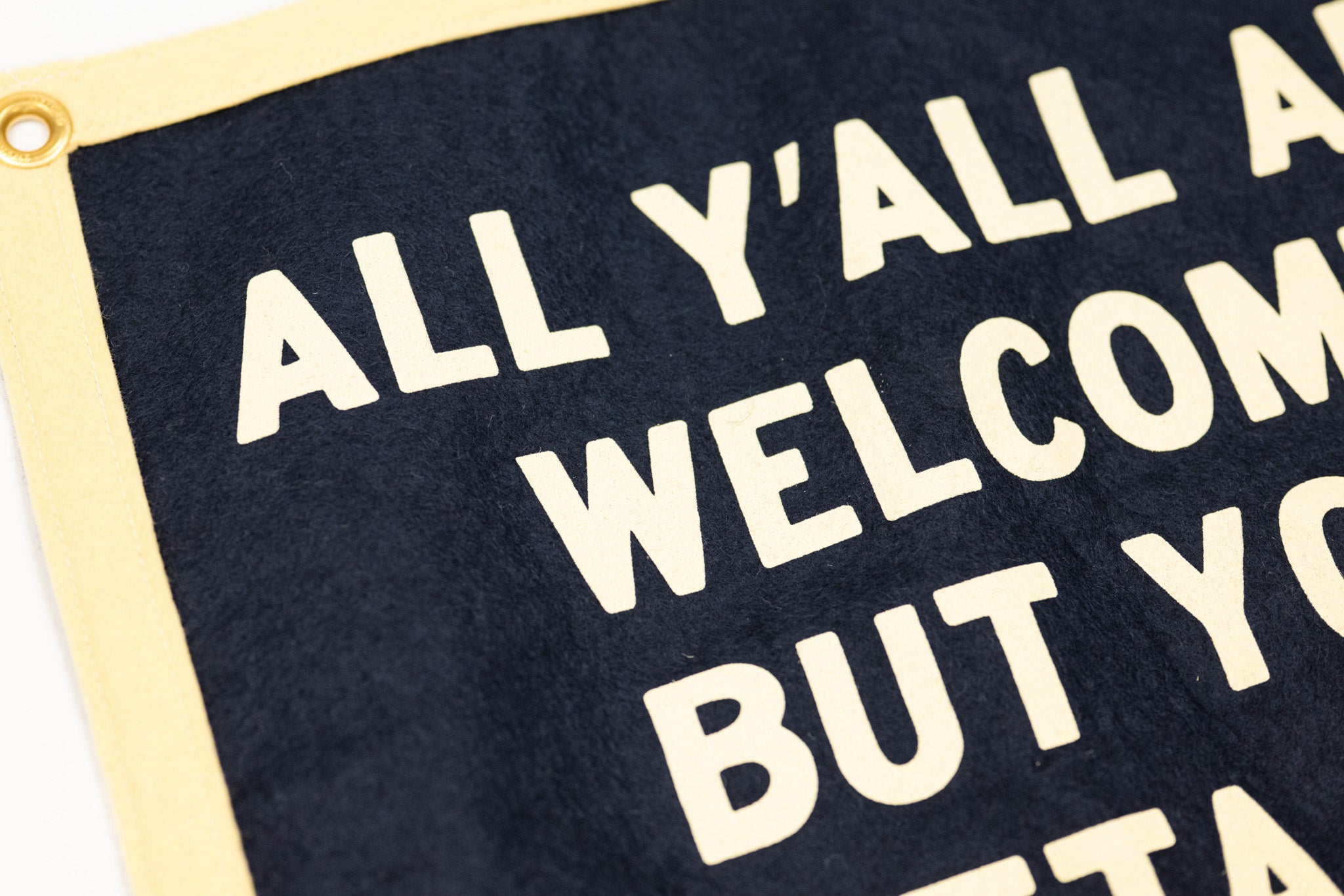 Text sign reading on a navy background.