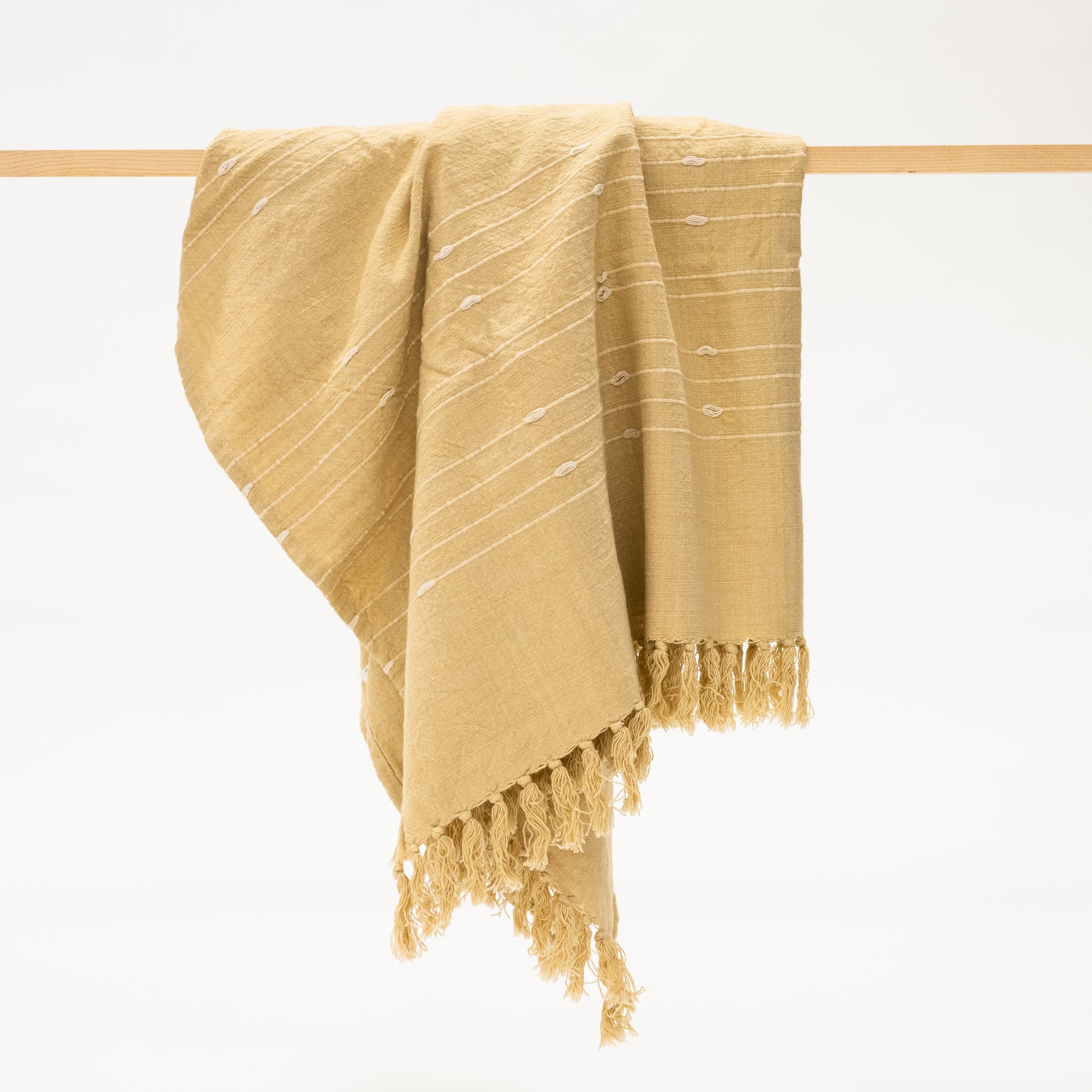 ochre yellow cotton throw blanket with tassels