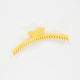 Yellow comb on a white background